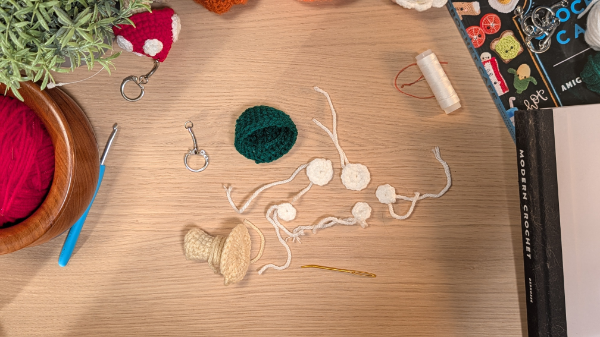 Mushroom keychain pieces laid out before assembly