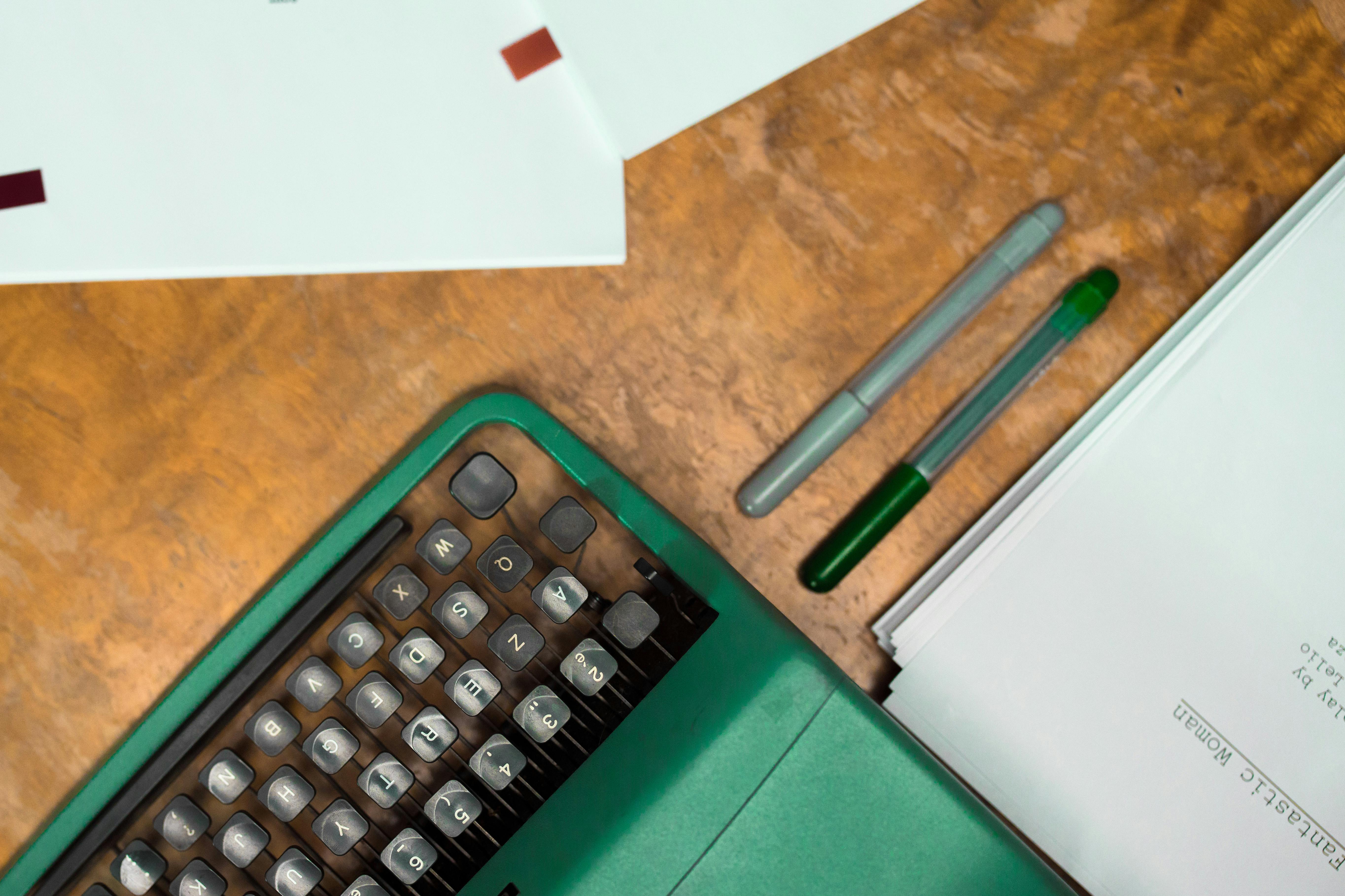 Marker Pens on Wooden Table by Ron Lach
